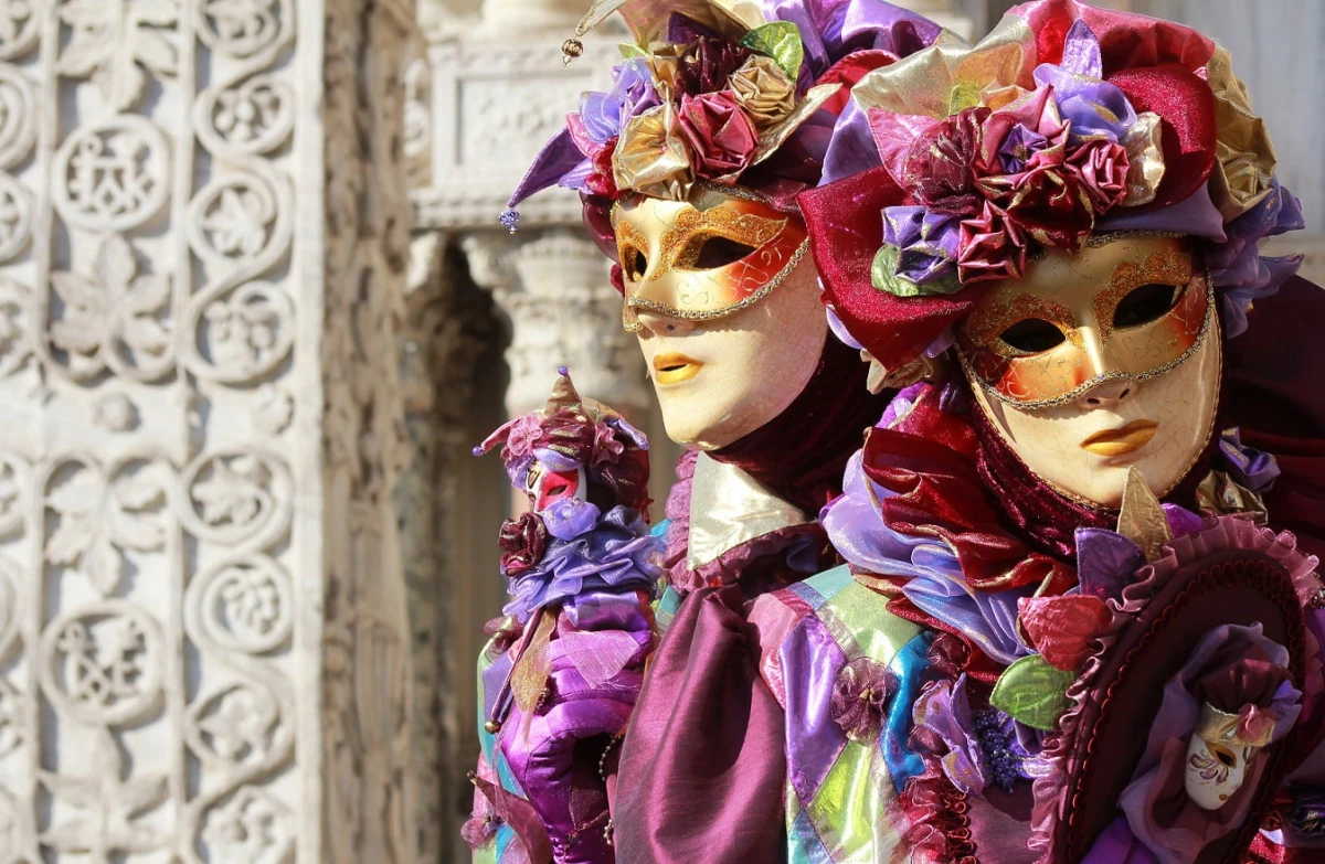 stock photo a couple of purple jokers marble column as background venice carnival 120437419 3